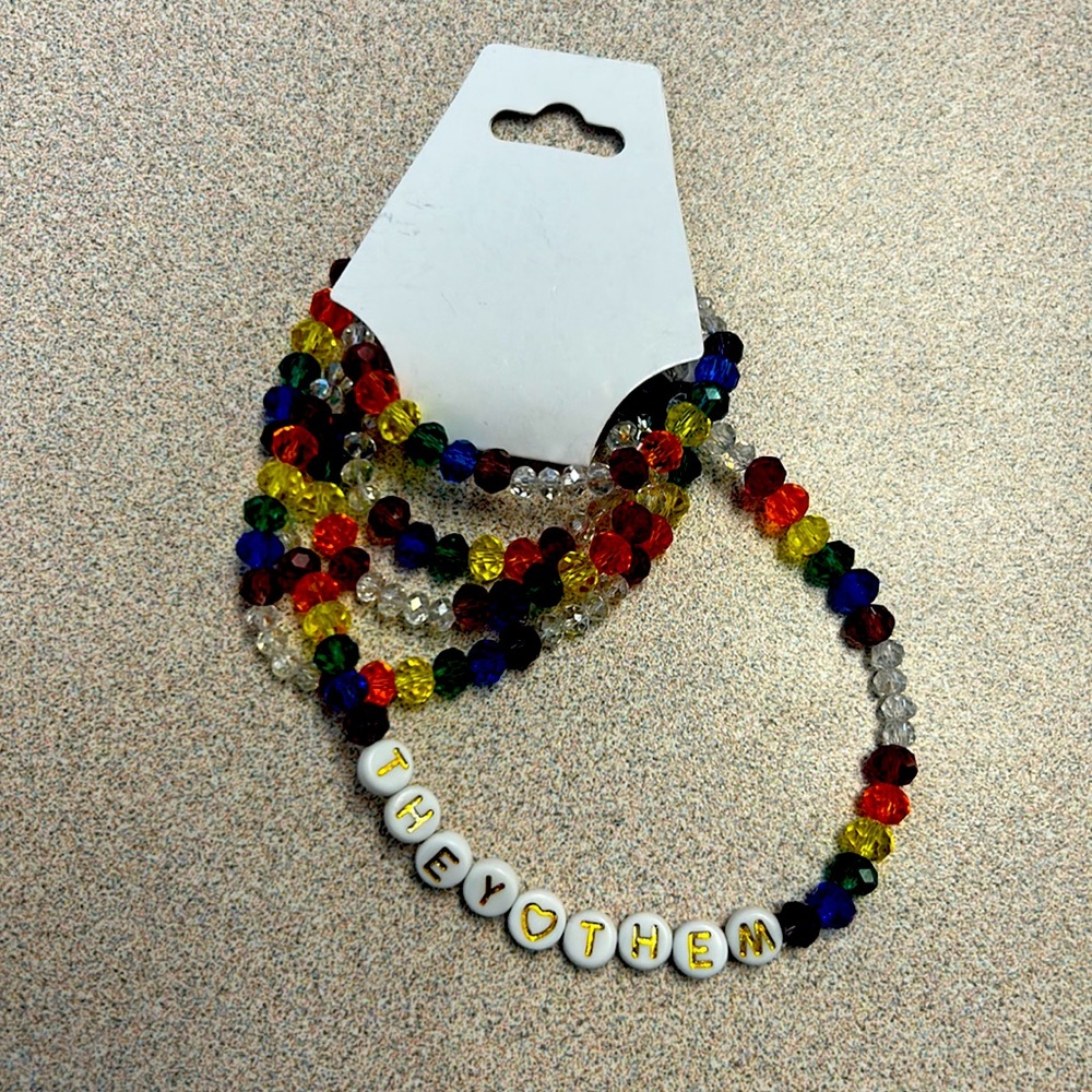 PRIDE They/Them pronoun rainbow belly chains
Medium size clear rainbow beads